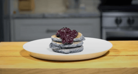 Corn pancakes with maple syrup and berry compote